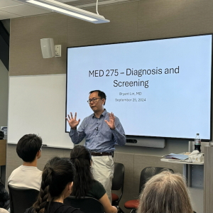Bryant Lin teaches a lung cancer class in fall 2024. He says he was very nervous to teach the first class and share his story.