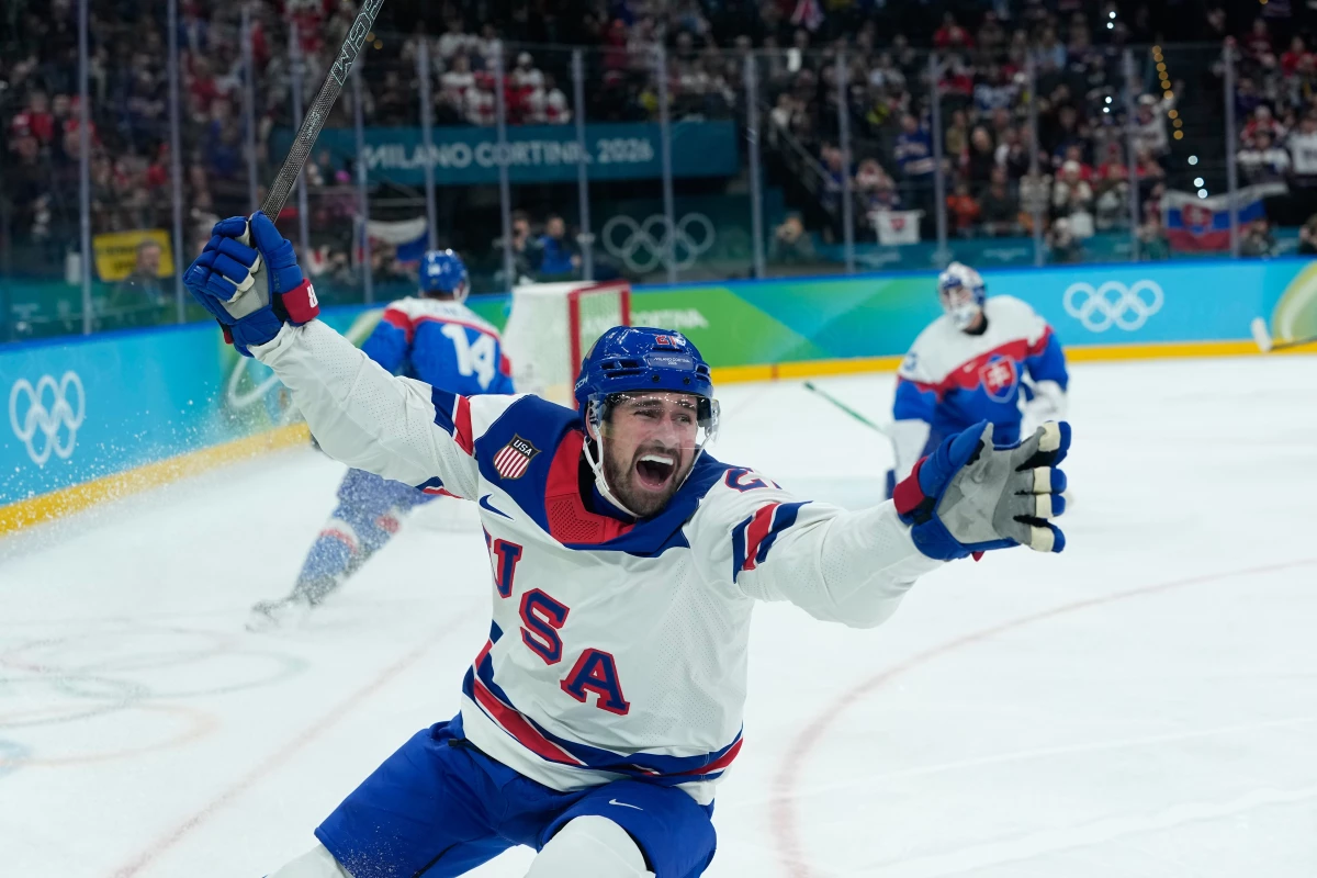 United States' Dylan Larkin (21) celebrates after scoring the opening goal during a men's ice hockey semifinal game between United States and Slovakia at the 2026 Winter Olympics, in Milan, Italy, Friday, Feb. 20, 2026. (AP Photo/Petr David Josek)