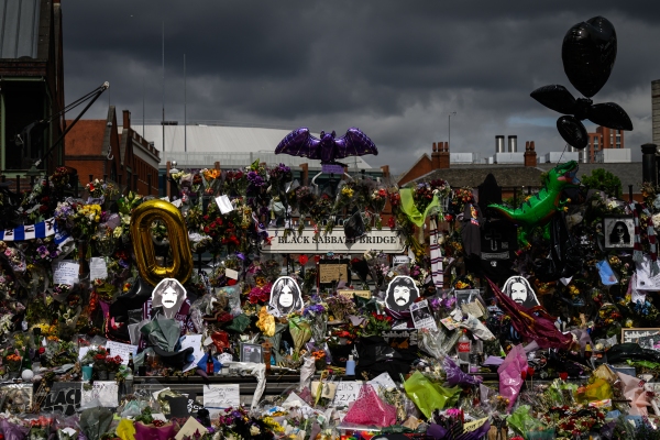Tributes are left prior to Ozzy Osbourne's funeral cortege traveling through his home city of Birmingham on Wednesday in Birmingham, England.