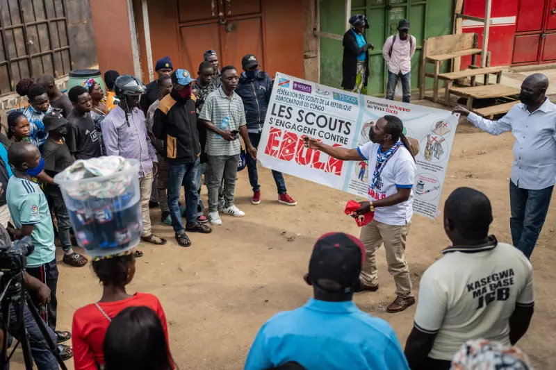 Francois Kasereka, a member of the Congo Scouts movement, speaks to people during a public sensitisation campaign amid the Ebola outbreak in Bunia, Congo, Saturday, May 23, 2026.