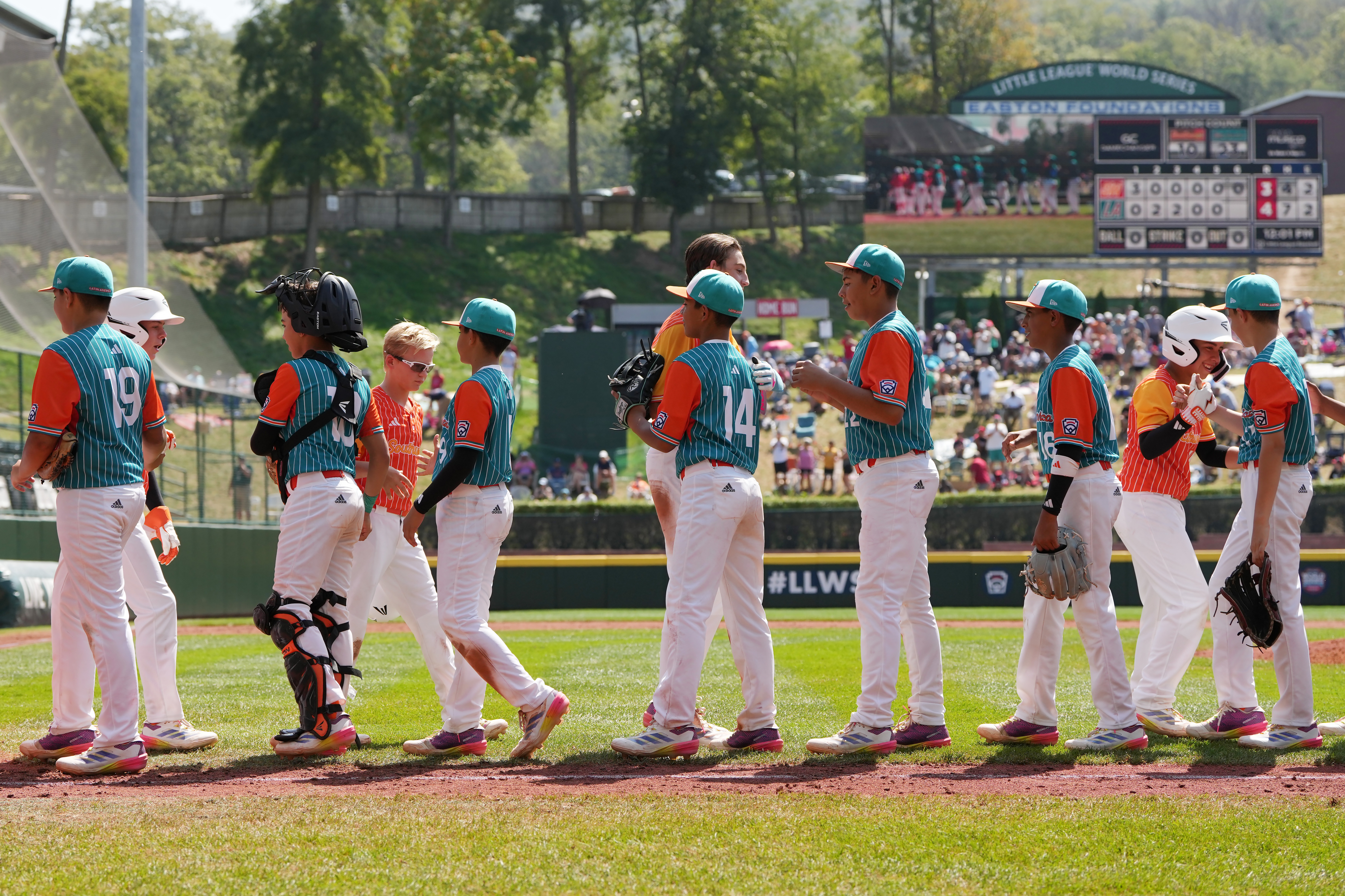 Members of the Southwest Region team from Boerne, Texas and the Latin America Region team from Barquisimeto, Venezuela shake handsafter Latin America won the Little League World Series Consolation Game 4-3 at Howard J. Lamade Stadium on August 25, 2024 in South Williamsport, Pennsylvania.