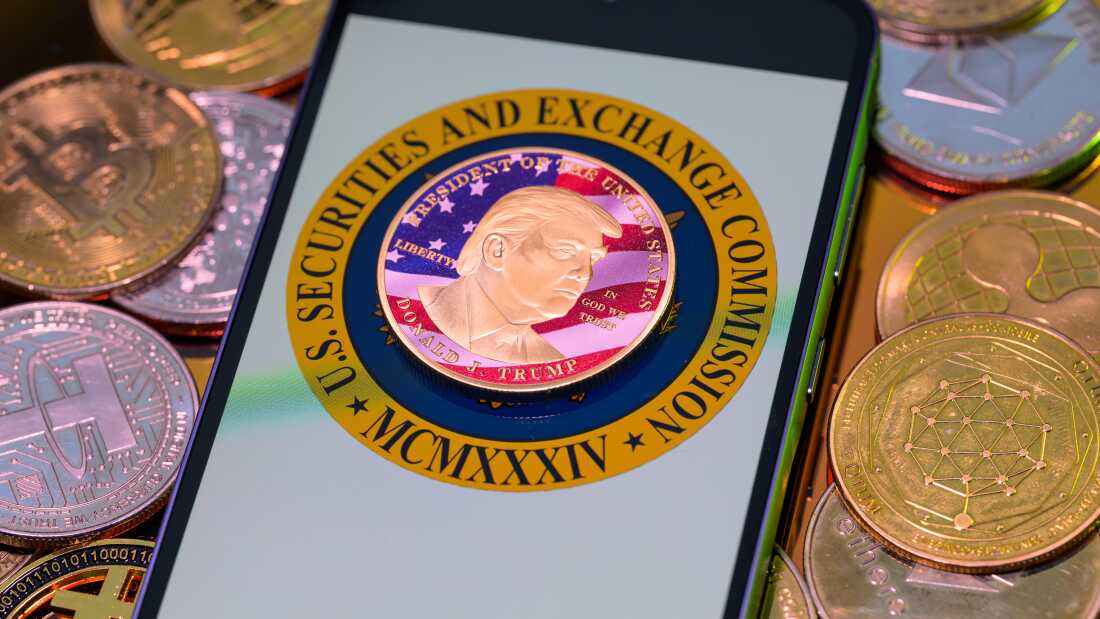 A photo illustration shows a representation of cryptocurrency coins with the $Trump meme coin (collection coin) in Brussels, Belgium, on Monday.