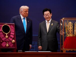 U.S. President Donald Trump reacts as he is presented with the Grand Order of Mugunghwa and the Silla gold crown by South Korean President Lee Jae Myung at the Gyeongju National Museum on October 29, 2025 in Gyeongju, South Korea.