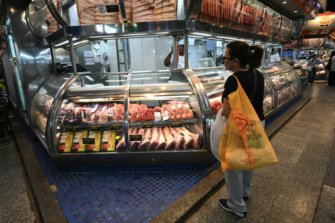 A shopper selects meat at the São Paulo Municipal Market in downtown São Paulo on Sept. 30, 2026, as the price of beef becomes a kitchen-table issue ahead of Brazil’s presidential election.