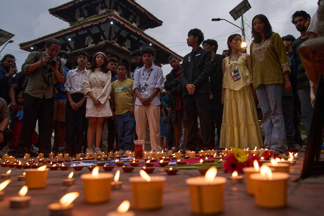 People take part in a candlelight vigil for victims of the floods in Nepal and Tibet, at Durbar Square in Kathmandu, Nepal, Saturday, Sept. 5, 2026.
