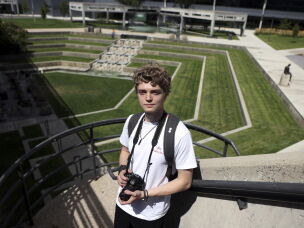 Student Kevin Haslem takes photos near the site where conservative commentator Charlie Kirk was killed on the campus of Utah Valley University in Orem, Utah, on Aug. 27, 2026.