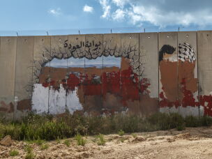 In Kfar Kila, Lebanon, a graffiti at the Fatima Gate has been crossed out. The landmark, located near the Lebanese village of Kfar Kila and Israel's Metula, marks a former border crossing between Lebanon and Israel. Israel closed the crossing when its forces withdrew from southern Lebanon in 2000, ending an 18-year occupation.