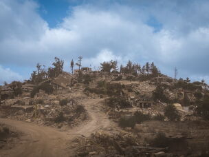 A view of Houla shows roads reduced to rough tracks, while homes have been destroyed and reduced to piles of concrete and rubble. Houla was the site of a massacre in 1948, shortly after the establishment of the state of Israel, in which Israeli forces killed dozens of Lebanese civilians.