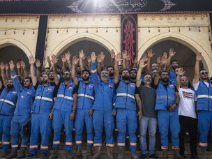 Paramedic teams mark Ashura in the mosque of a largely emptied city, surrounded by damaged buildings, in Nabatiyeh, Lebanon.