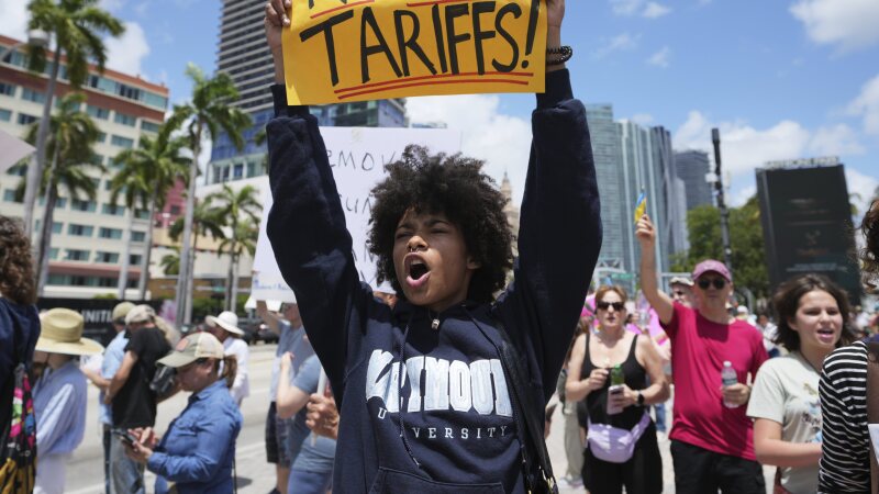 Paul Ivanov chants during a protest against the Trump administration on Saturday in Miami.