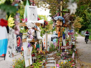 A memorial for Renee Good, who was killed by federal agents in Minneapolis in January, remains in place at the site of her death, Thursday, Oct. 1, 2026, in Minneapolis.