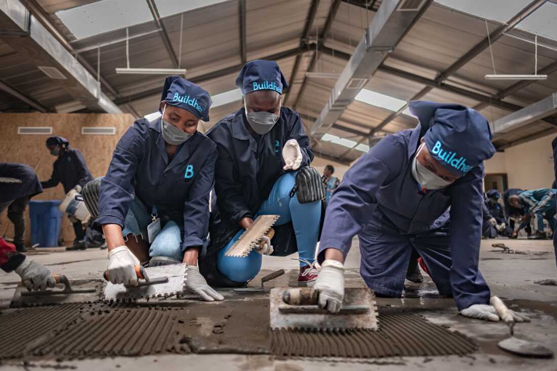 Women take part in a tiling class at the Buildher Academy in Nairobi, Kenya.