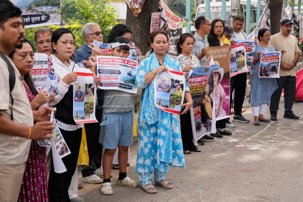 As Nepal identifies those killed in the floods, questions grow over China's reporting