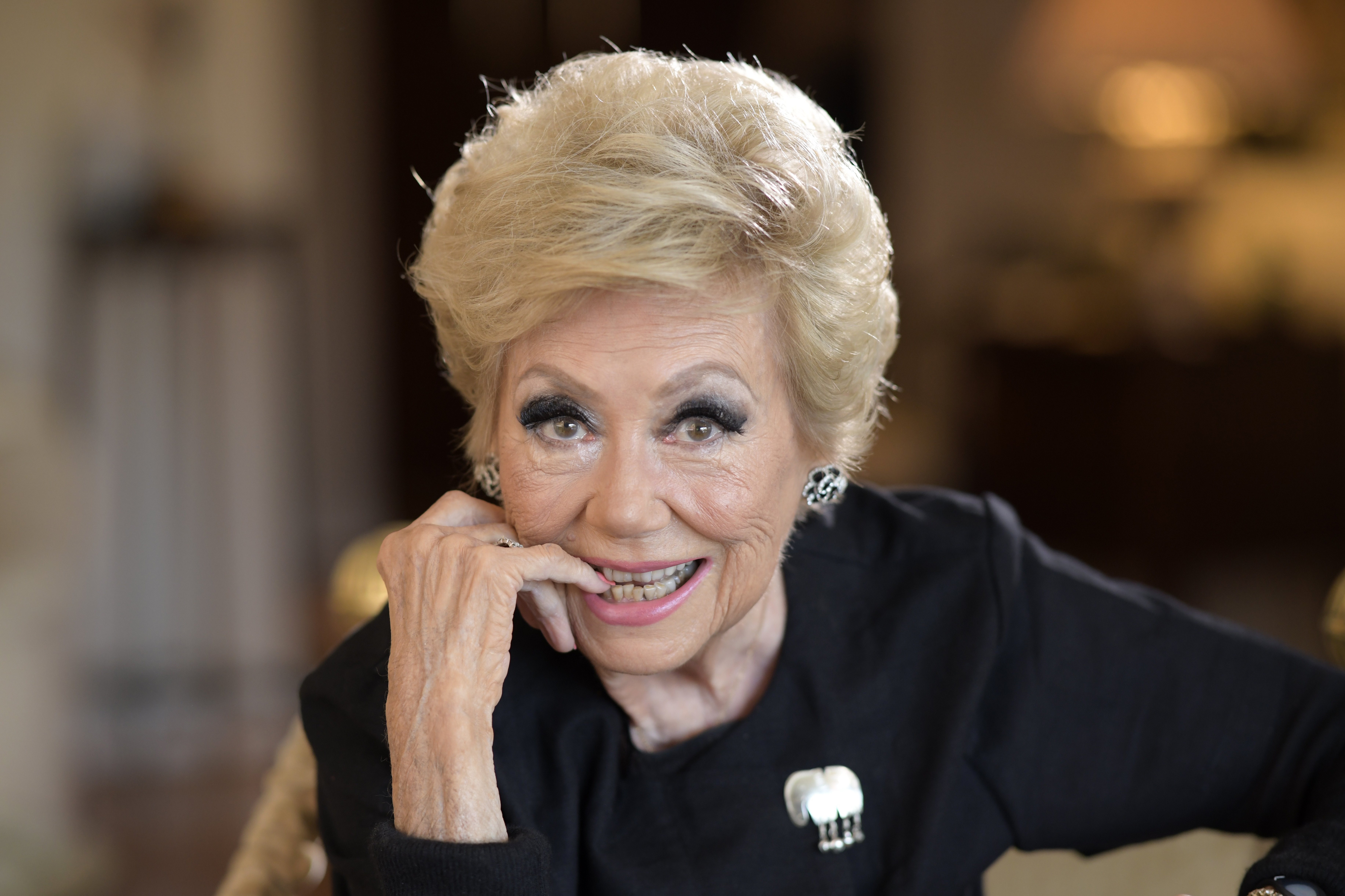 Actress Mitzi Gaynor poses in her apartment in Beverly Hills, Calif., on May 26, 2021. Gaynor, among the last survivors of the so-called golden age of the Hollywood musical, died of natural causes in Los Angeles on Thursday. She was 93.