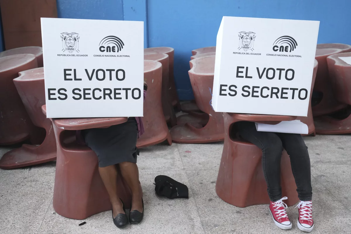 Voters mark ballots for their candidate of choice during the presidential election in Quito, Ecuador on Feb. 9, 2025.
