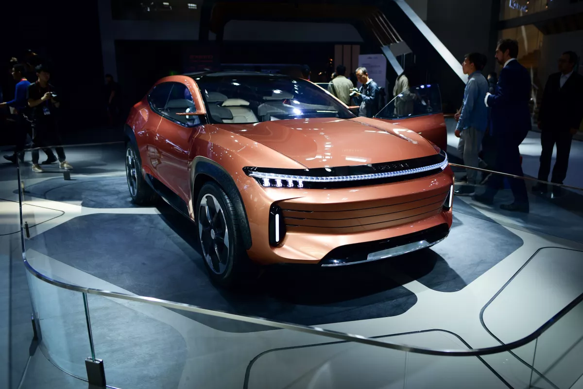 A Chery Exceed LX car is displayed at the Beijing auto show. Chinese electric vehicle companies like Chery are selling their cars across Latin America.
