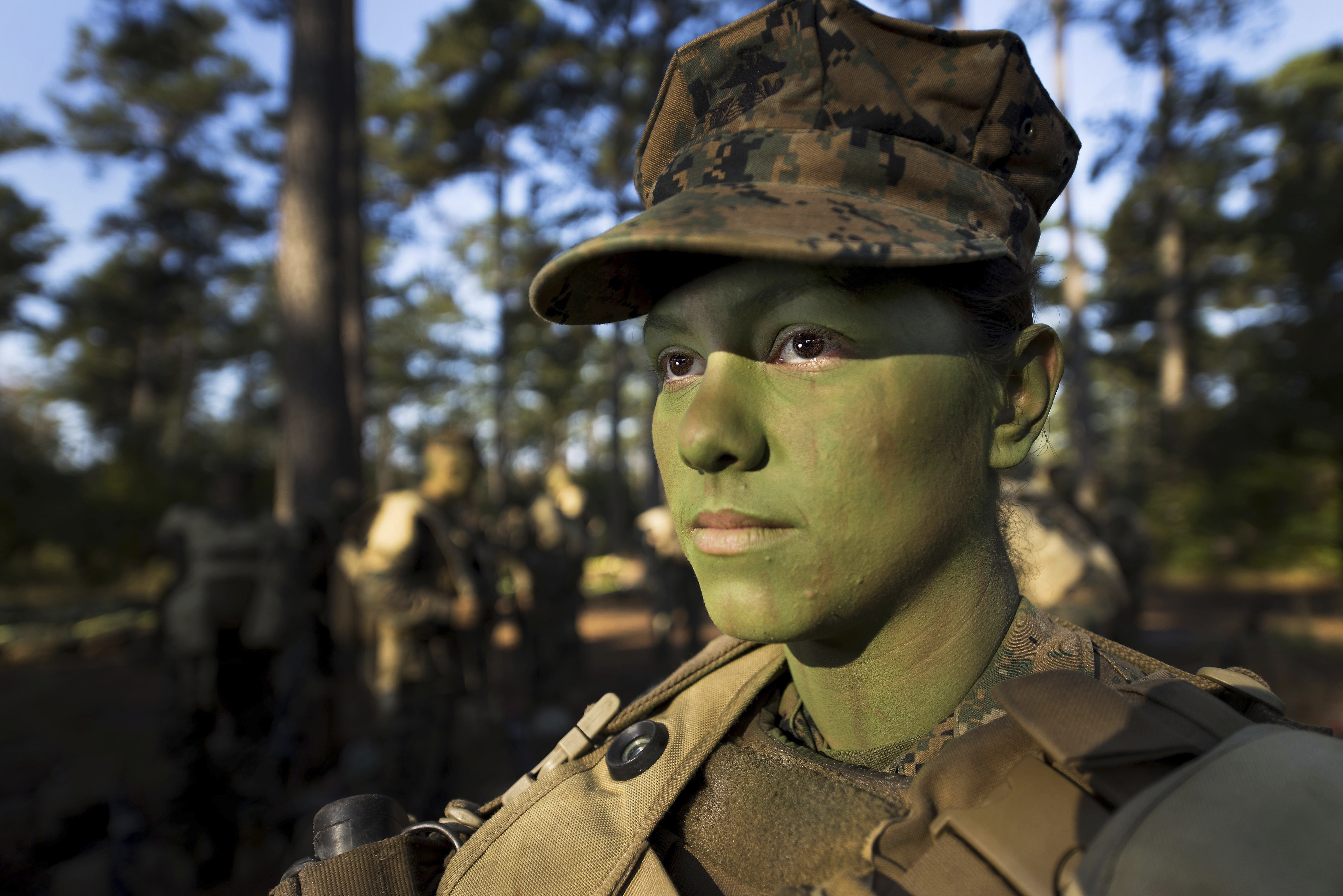 Pfc. Christina Fuentes Montenegro prepares to hike to her platoon's defensive position during patrol week of Infantry Training Battalion near Camp Geiger, N.C., in 2013. (U.S. Marine Corps via AP)