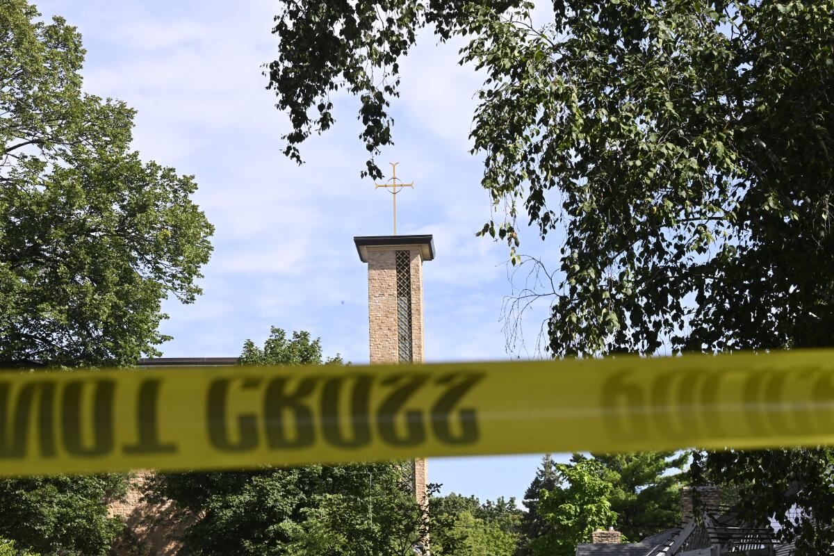 Annunciation Catholic Church is seen behind police tape following a mass shooting on August 27, 2025 in Minneapolis, Minnesota. According to Minneapolis Police, a gunman fired through the windows of the Annunciation Church at worshippers sitting in pews during a Catholic school Mass, killing two children and injuring at least 17 others. The gunman reportedly died at the scene from a self-inflicted gunshot wound.