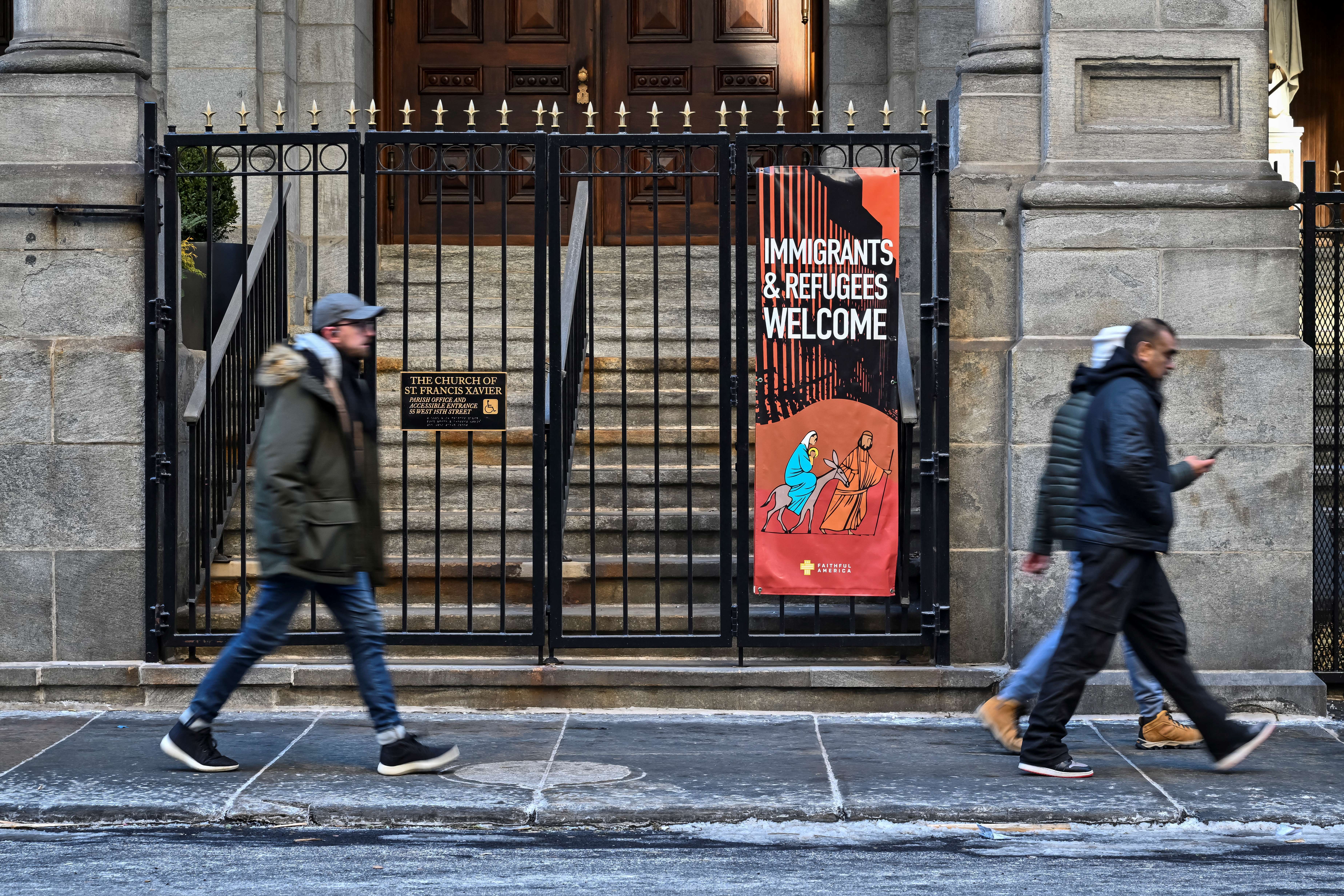 A church displays a sign saying, "Immigrants & Refugees Welcome" in New York.