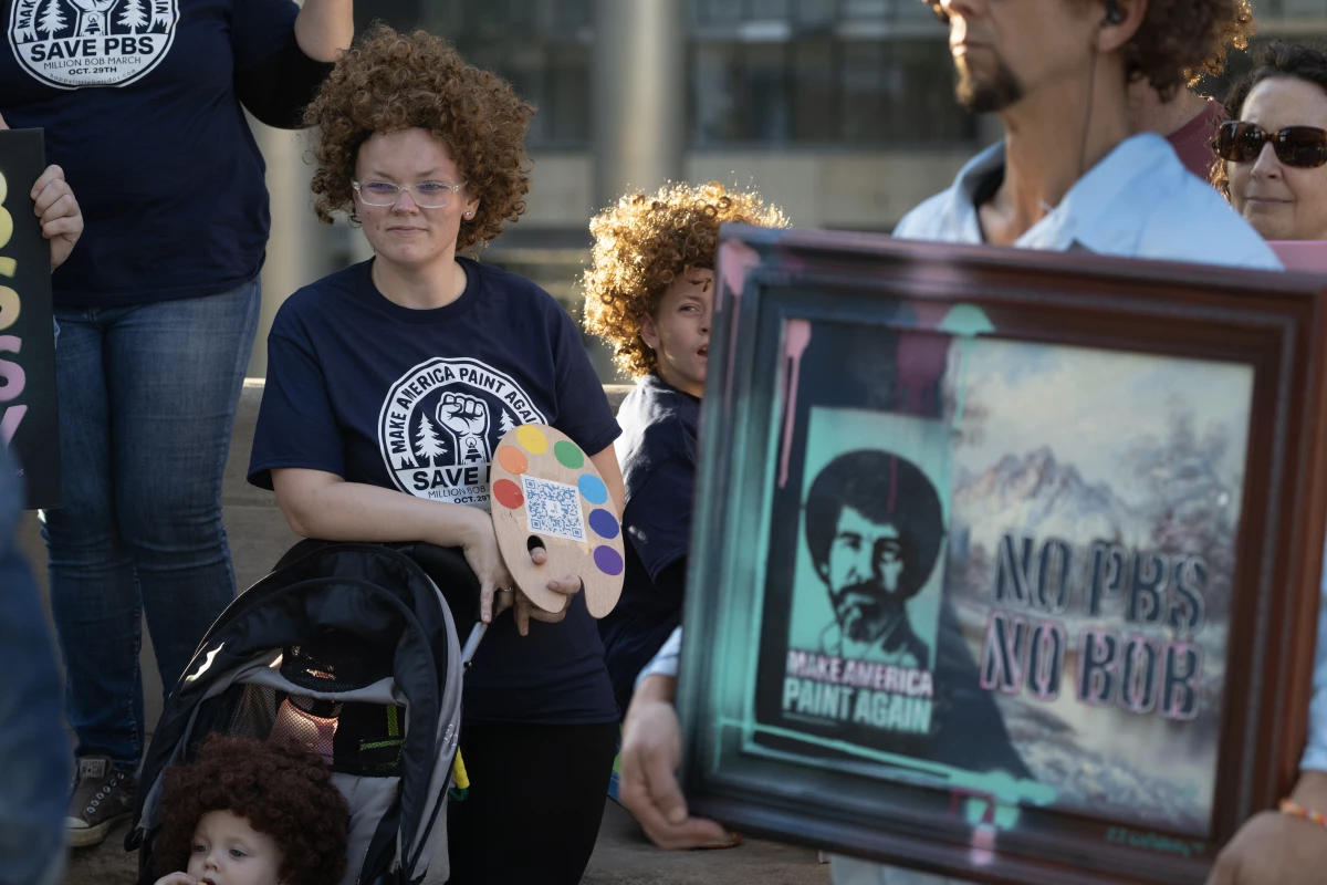 Demonstrators dressed as Bob Ross at a Chicago protest calling for the restoration of federal funding to PBS in late September.