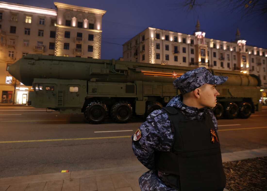 A Russian National Guard soldier stands in front of a Yars nuclear missile during Victory Day Parade dress rehearsals in 2024. The Yars is a type of intercontinental ballistic missile that can strike at hypersonic speeds.