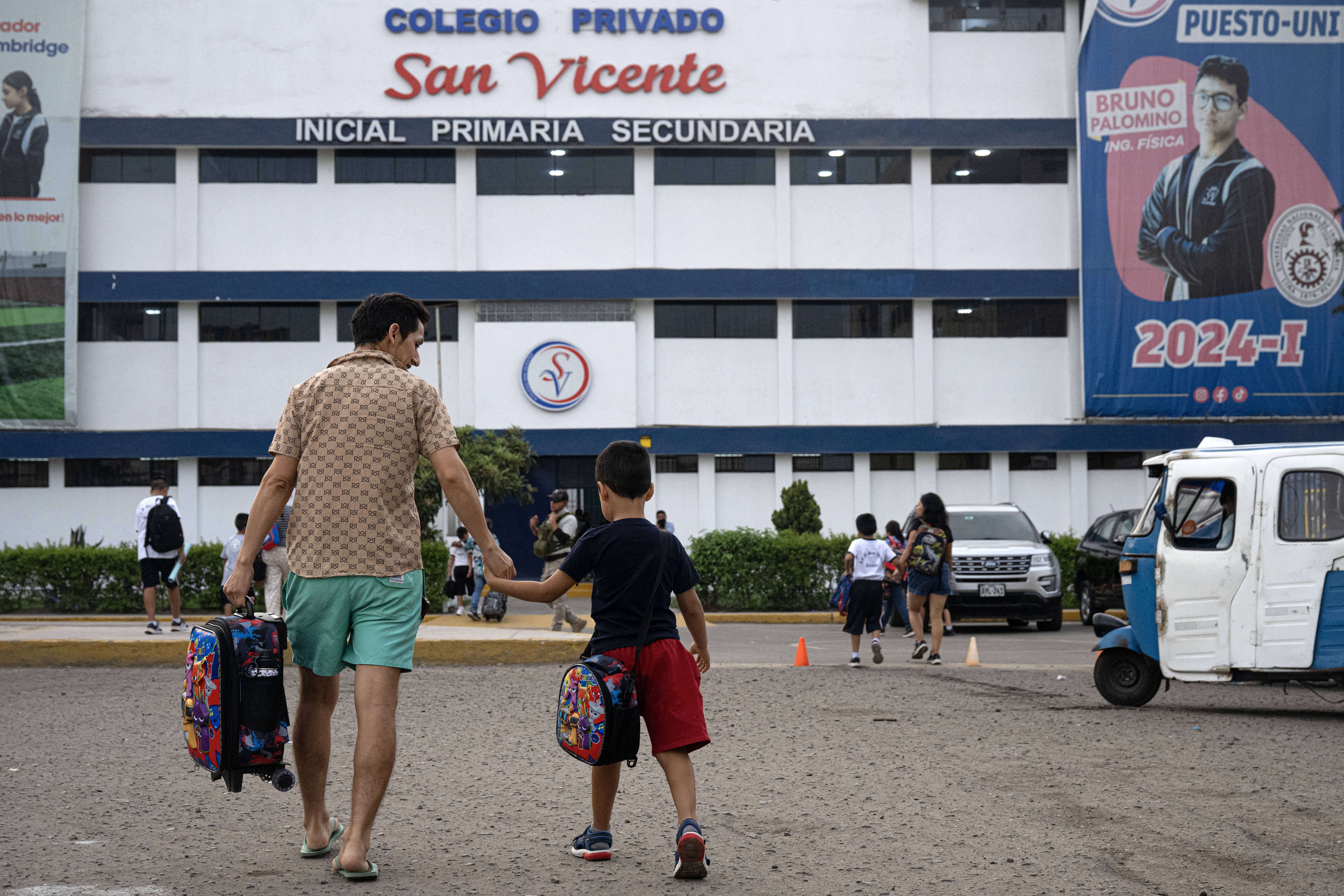 Parents drop off their children at the private San Vicente School in Lima, Peru, which was targeted for extortion, in April.