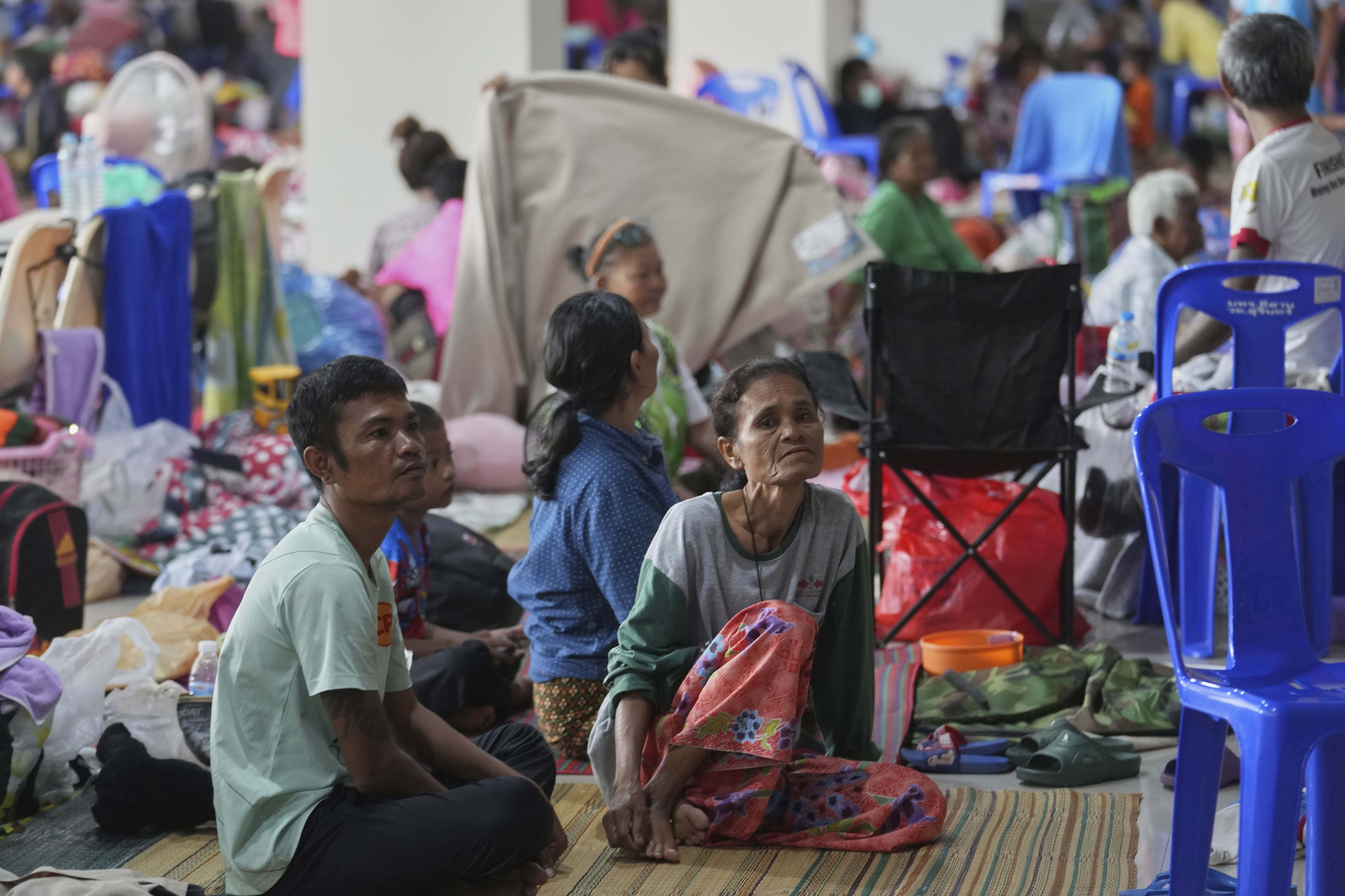 Thai residents who fled homes following clashes between Thai and Cambodian soldiers rest at an evacuation center in Surin province, Thailand, Sunday, July 27, 2025.