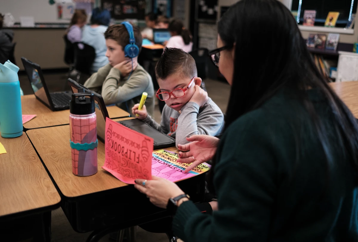 Kellen Hedler and his classmates, including his best friend, Nolan Robbins (left), learn about the structure of the U.S. government with teacher Robyn Fox.