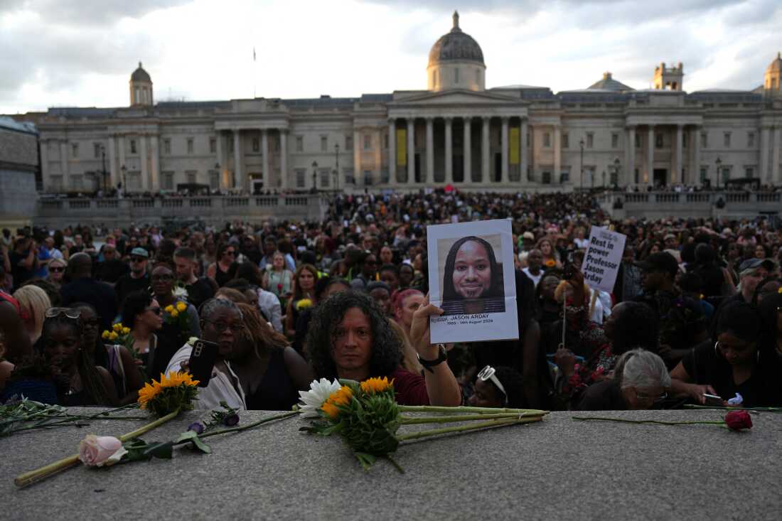 Supporters leave flowers and photographs at a vigil for late Cambridge professor Jason Arday in London on Aug. 17. Arday died Aug. 14 at age 41 amid allegations of plagiarism and embellishing his biography.