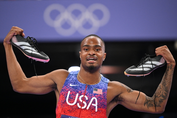Quincy Hall celebrates winning the gold medal for the U.S. after competing in the Men's 400m final on Wednesday at Stade de France at the Paris Summer Olympics.
