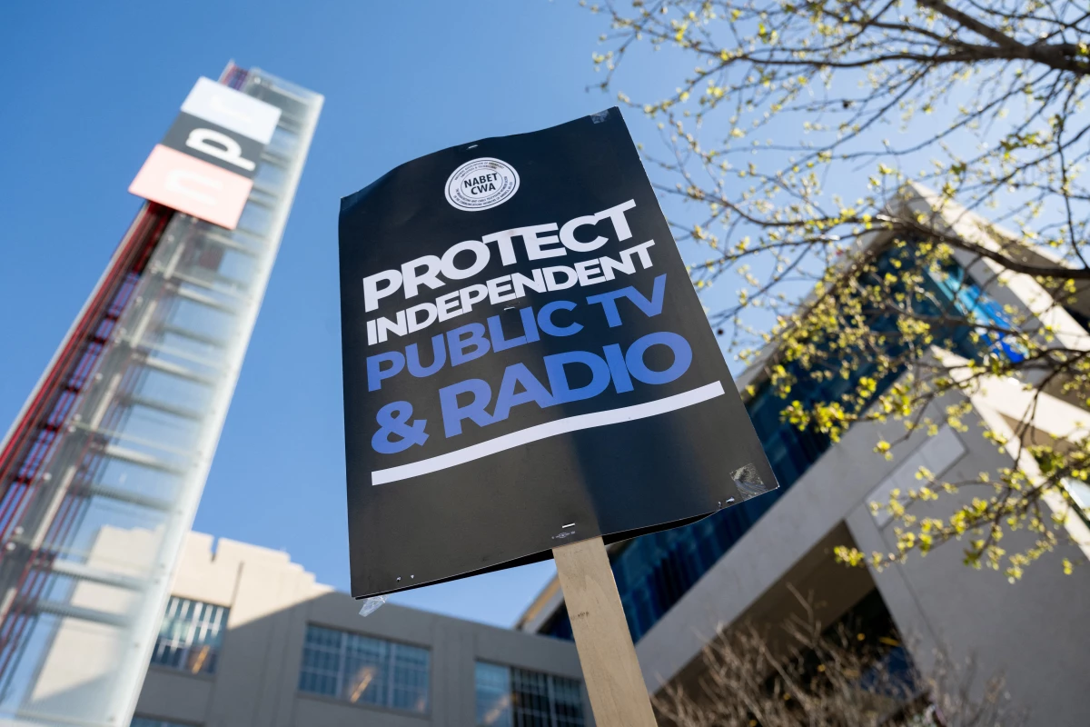 People participate in a rally to call on Congress to protect funding for US public broadcasters, Public Broadcasting Service (PBS) and National Public Radio (NPR), outside the NPR headquarters in Washington, DC, on March 26, 2025.