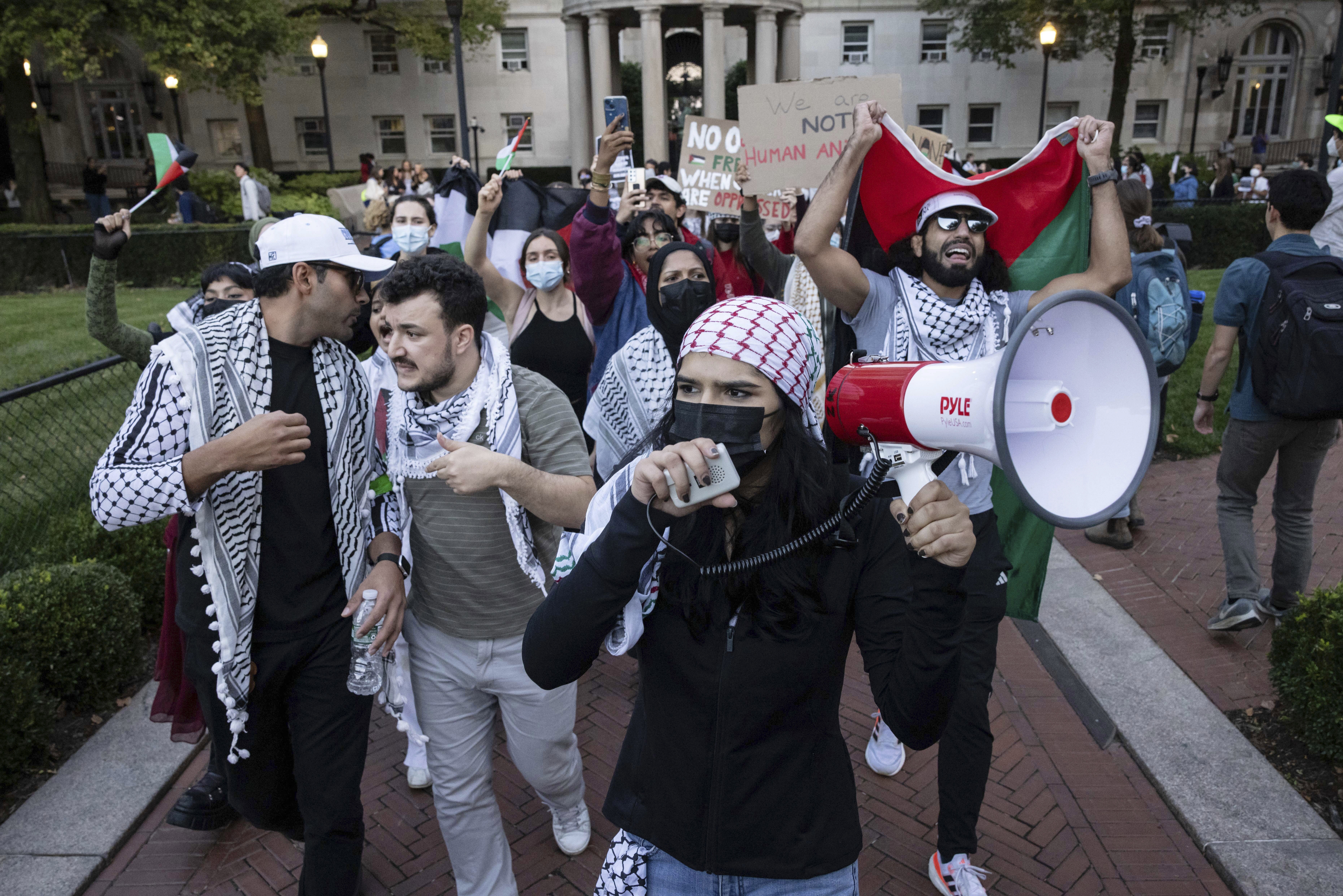 Pro-Palestinian supporters, including Mahmoud Khalil (second from left), demonstrate during a protest at Columbia University in New York in October 2023. (AP)