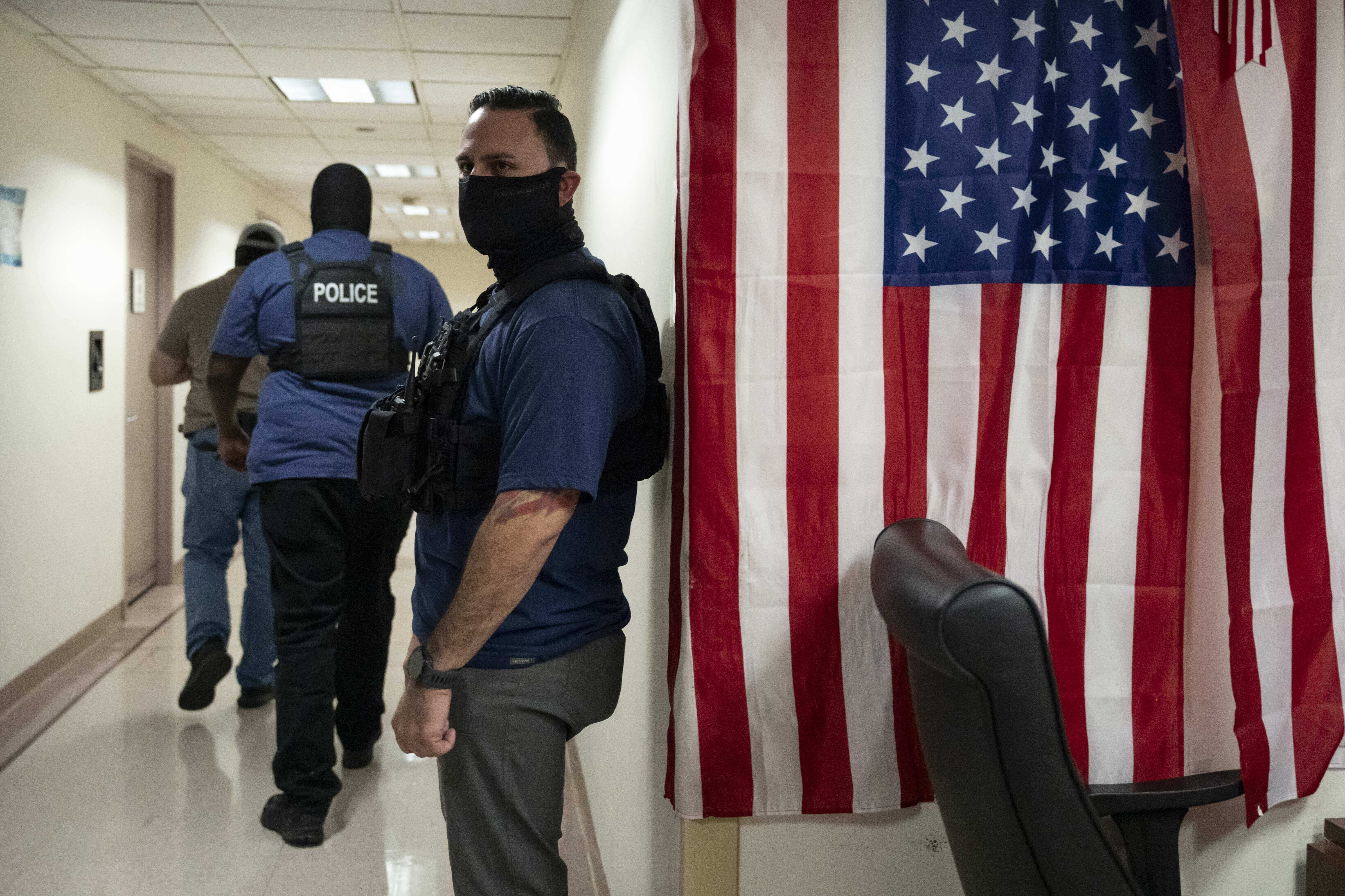 Federal agents stand outside an immigration court at the Jacob K. Javits federal building in New York in September 2025. (AP)