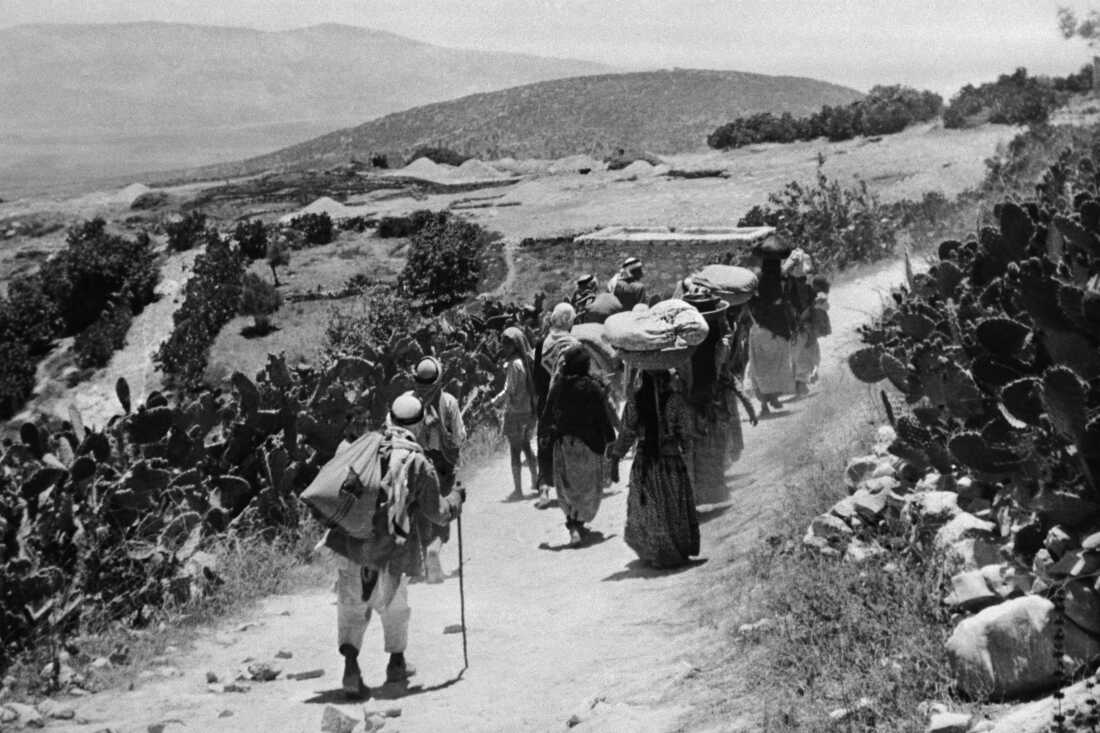 A picture released 15 September 1948 shows Arab Palestinians refugees returning to their village after its surrender during the 1948 Arab war against the proclamation of the Israeli State.