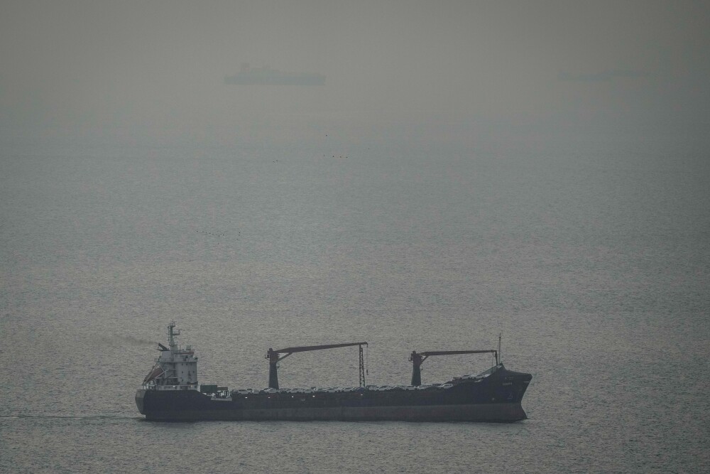 A cargo ship carrying vehicles sails through the Arabian Gulf toward the Strait of Hormuz in the United Arab Emirates on March 22.
