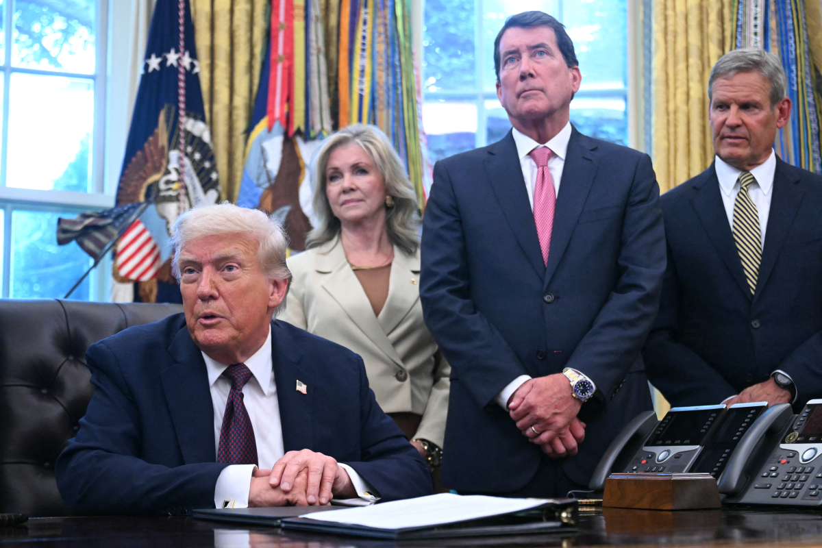 U.S. Sen. Marsha Blackburn, Tennessee Gov. Bill Lee, and U.S. Sen. Bill Hagerty listen at the White House in September as President Trump speaks after signing an order sending National Guard troops to Memphis.