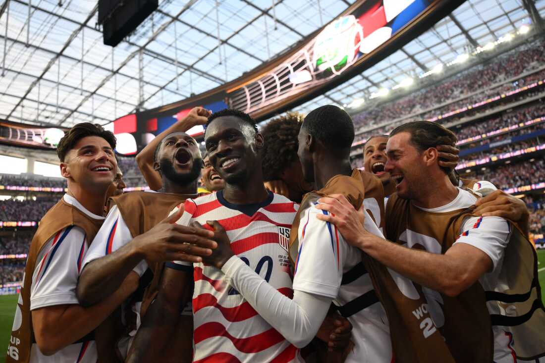 U.S. forward Folarin Balogun (c) celebrates with teammates after scoring his second goal during the U.S.'s opening 4-1 victory over Paraguay in the group stage of the World Cup at Los Angeles Stadium on June 12, 2026.