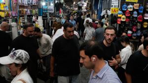 People walk in Tehran's traditional main bazaar, Iran, Saturday, Aug. 8, 2026. 