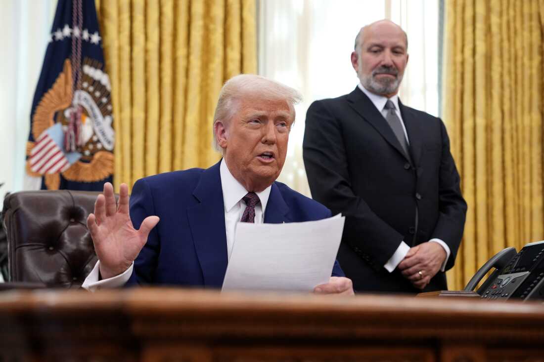 President Trump is joined by Commerce Secretary Howard Lutnick, who oversees the Census Bureau, as he speaks in the White House’s Oval Office in 2025.
