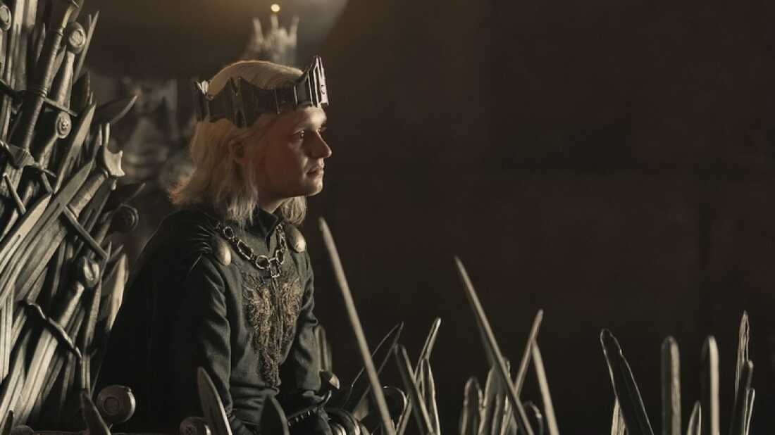Aegon II (Tom Glynn-Carney) on the famously pointy and rusty Iron Throne.