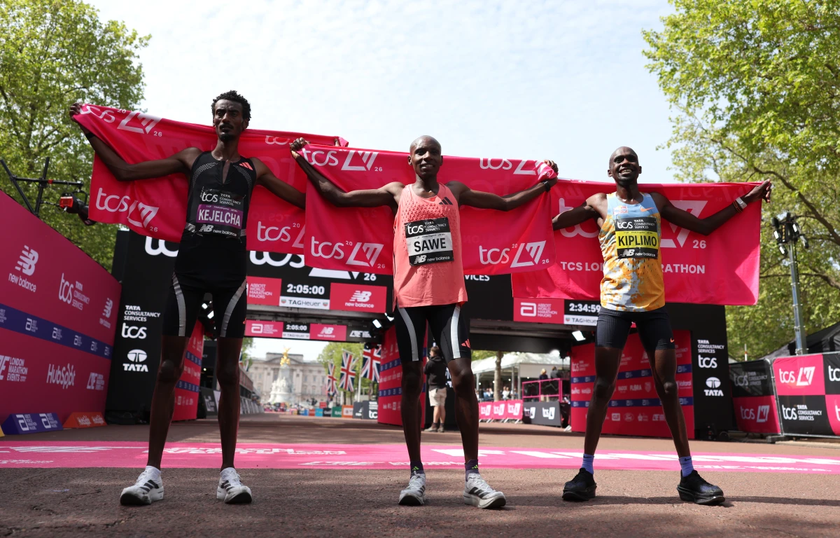 1st placed Sabastian Sawe of Team Kenya (C), 2nd placed Yomif Kejelcha of Team Ethiopia (L) and 3rd placed Jacob Kiplimo of Team Uganda (R) pose for a photo after the Men's 2026 TCS London Marathon on April 26, 2026 in London, England.