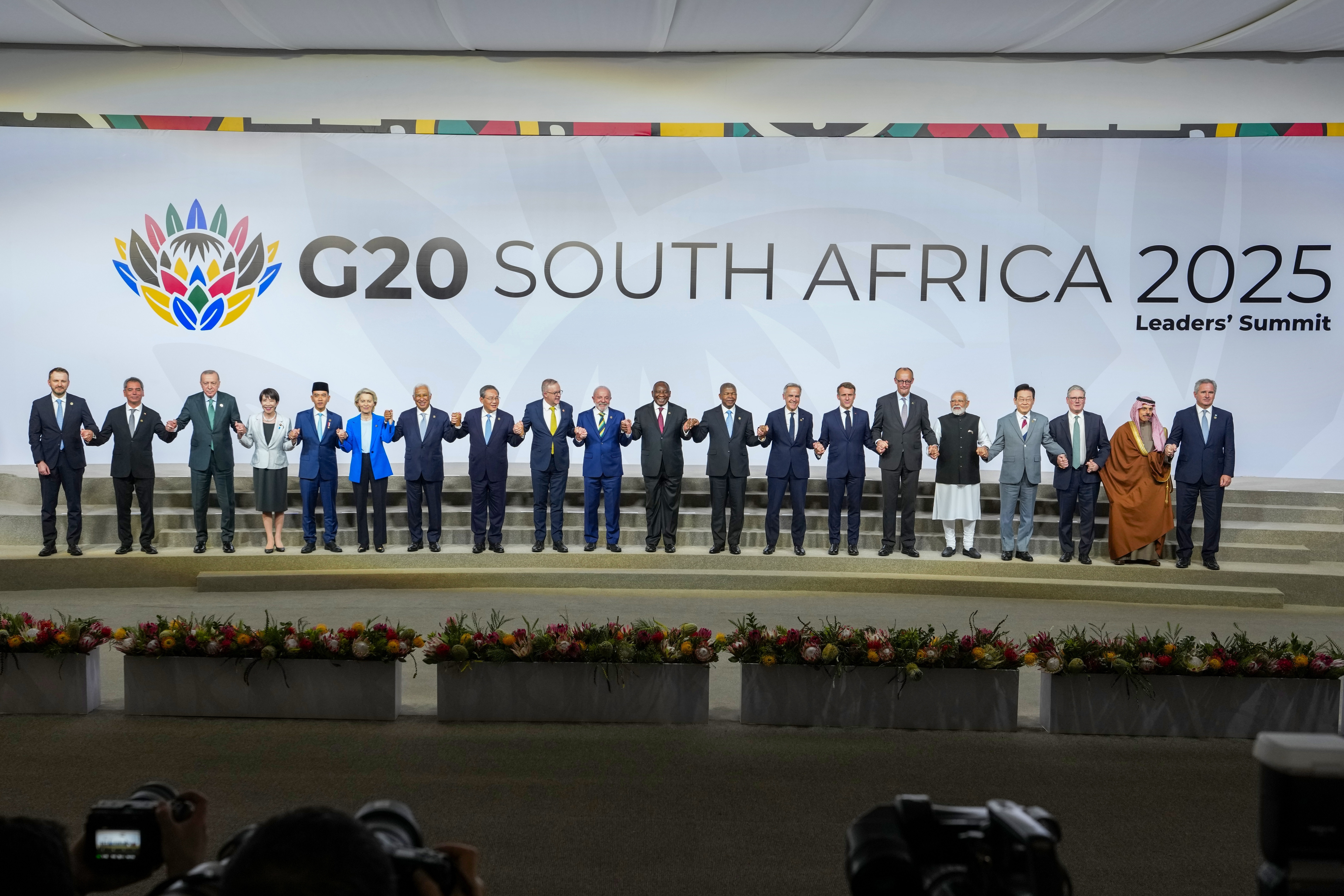 Heads of states pose for a family photo following the first plenary session of the G20 leaders