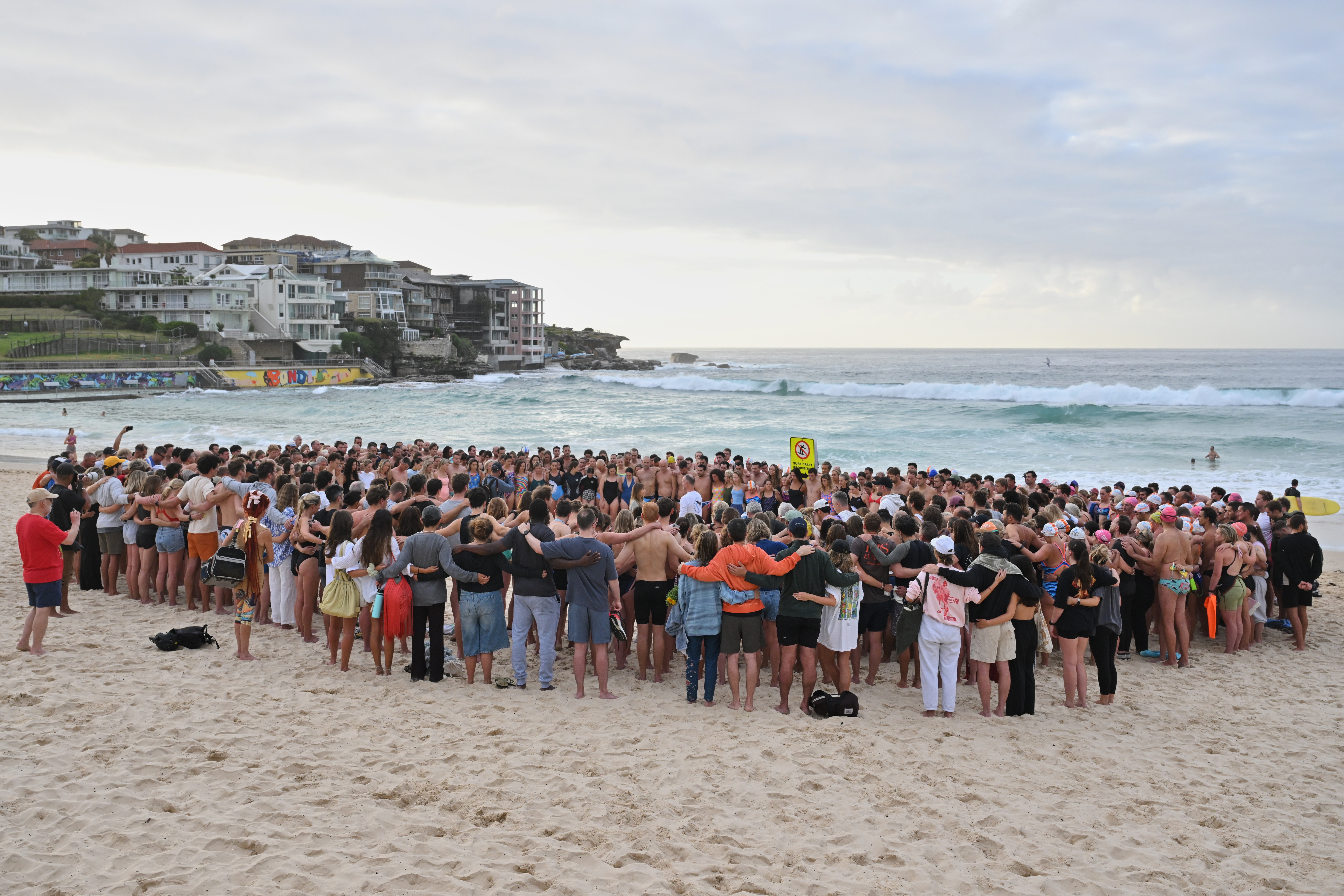 Swimmers gather for a morning vigil in Sydney, Wednesday, Dec. 17, 2025, following Sunday's shooting at Bondi Beach. (AP)