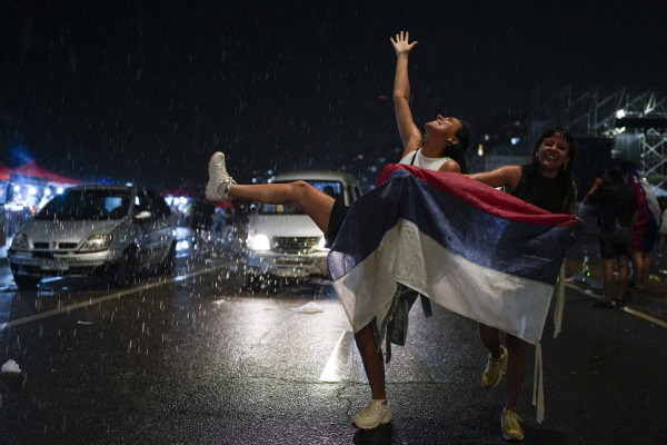 Supporters of the Frente Amplio (Broad Front) celebrate the victory of candidate Yamandú Orsi in the presidential run-off election in Montevideo, Uruguay on Sunday.