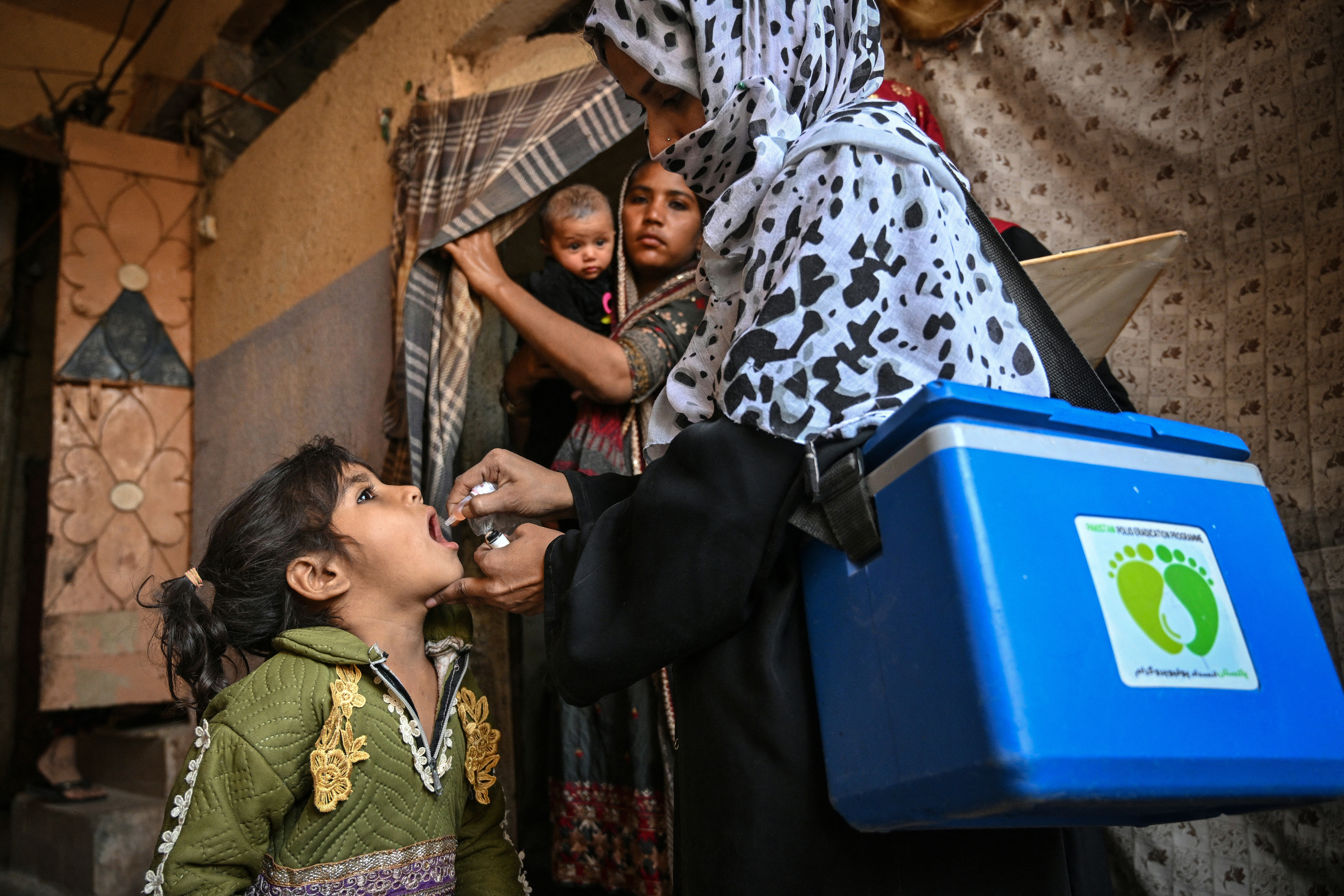 A health worker in Karachi administers polio drops — the oral vaccine — on February 3, the first day of a nationwide polio vaccination campaign. The country, one of only two where wild polio circulates, has seen a rise in cases due to issues with vaccination campaigns.
