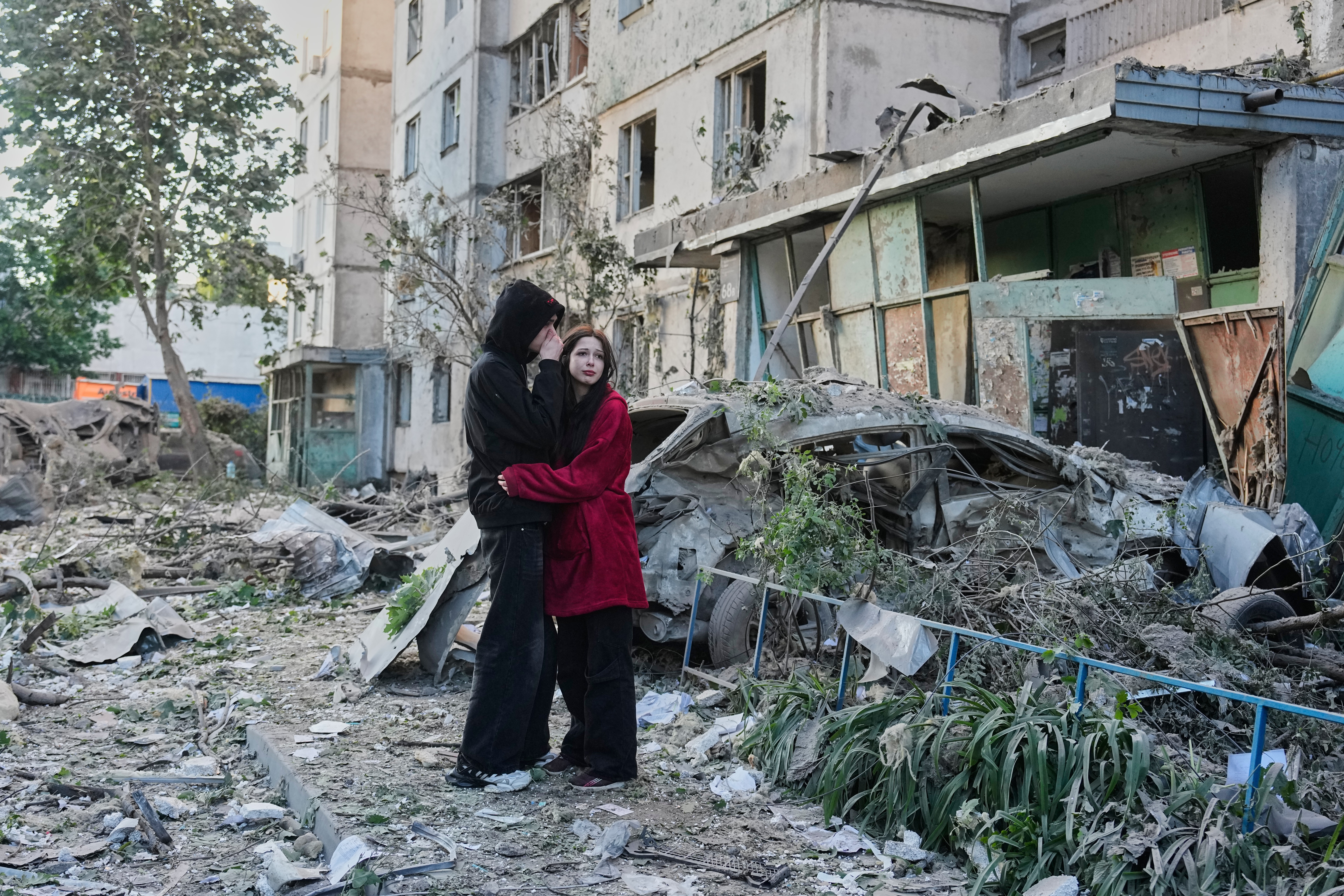 Russian attack on Ukraine kills at least 11 and traps others in damaged buildings