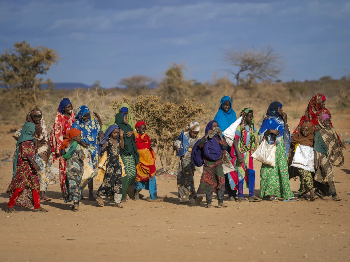 People arrive at a displacement camp amid a drought on the outskirts of Dollow, Somalia.