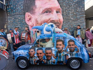 People sing happy birthday to Lionel Messi at a street mural of him in Buenos Aires, Argentina, June 24.