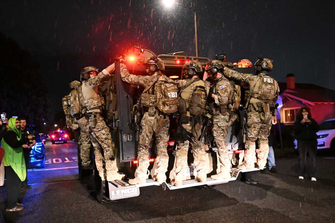 FBI officers leave the scene after responding to an address connected to Cole Tomas Allen, the shooting suspect at the White House Correspondents Dinner on Sunday in Torrance, Calif.