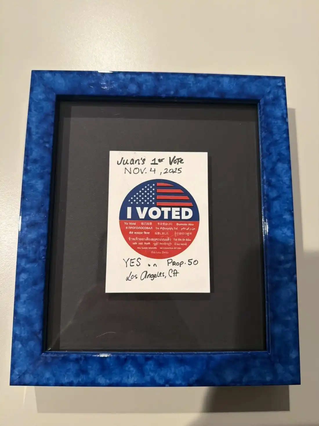 Juan Escalante voted for the first time in the 2025 California special election on redistricting and framed his "I Voted" sticker.